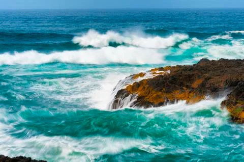 Closeup of churning waves at Devils Churn Stock Photos