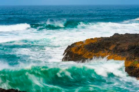 Closeup of churning waves at Devils Churn Stock Photos