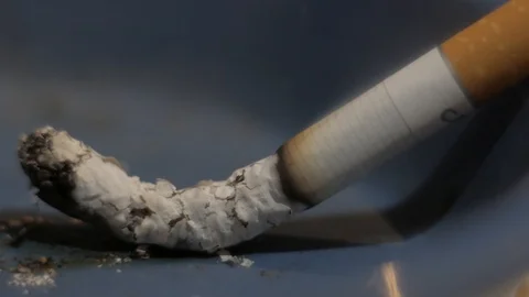 demon cigarette demon smoking cigar Stock Photo