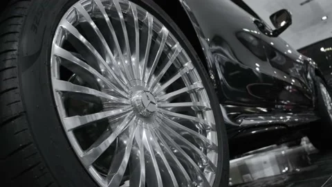 Closeup cinematic view on modern multispoke alloy wheel for luxury SUV Stock Footage 218633063