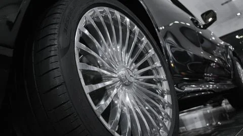 Closeup cinematic view on modern multispoke alloy wheel for luxury SUV Stock Photos