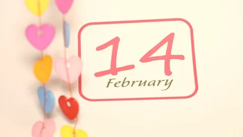 Closeup of circle mark for Valentine day reminder on calendar page of 14 Stock Footage 99746003