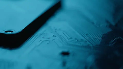 Closeup circuit processing signals on digital motherboard. Electronic board Stock Footage 332673829