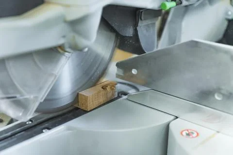 Closeup circular sawmill machine cutting wooden board Stock Photos