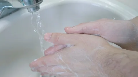 Closeup of Cleaning Hands Under Running Faucet Stock Footage 126554612