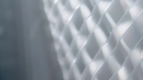 Closeup of clear plastic with a woven texture. The plastic has a intricate Stock Footage 253925888