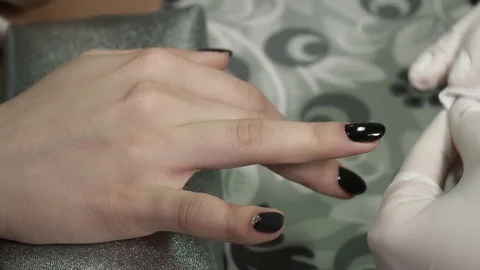 Closeup of clearing sticky layer from the nails Video stock 73446923