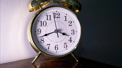 Closeup of clock in reverse time lapse to show passage of time. Stock Footage 336446085