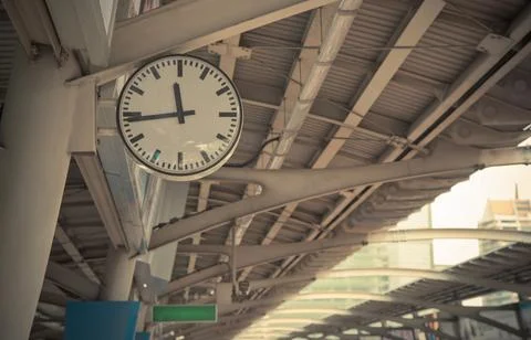 Closeup Clock at the sky-train station - vintage tone Stock Photos