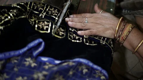 Closeup of cloth cutting, a worker working in textile factory and sewing fabric Stock-Footage 205164927