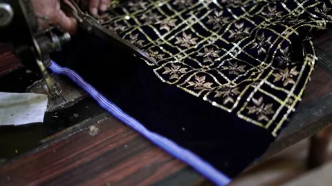 Closeup of cloth cutting, a worker working in textile factory and sewing fabric Stock-Footage 205165113