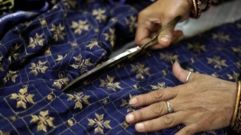 Closeup of cloth cutting, a worker working in textile factory and sewing fabric Stock-Footage 220225940