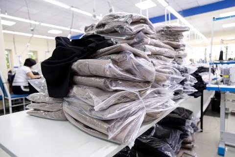 Closeup of clothes in polyethylene packaging made in tailoring shop Stock Photos
