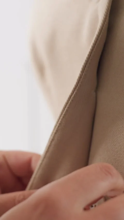 Closeup of clothing craftsmanship, Precise sewing and tailoring craftsmanship Stock Footage 326934799