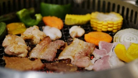 Closeup of coal grill barbecue with fresh delicious meat and vegetable Stock Footage 101004875