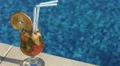 Closeup of cocktail on the pool deck. Vacation, resort, holiday HD Footage