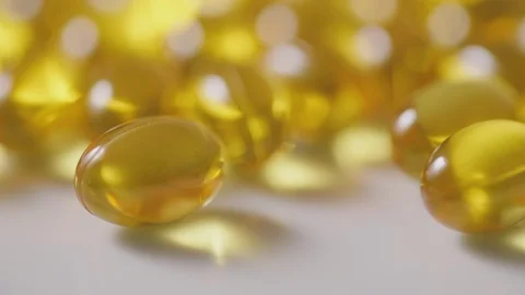 Closeup Of Cod Liver Oil Pills Representing Healthcare 4K Stock Footage 86082456