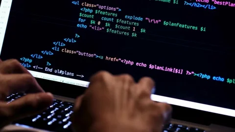 Closeup coding on Programmer working on online application database. Coder Stock Footage 334585950