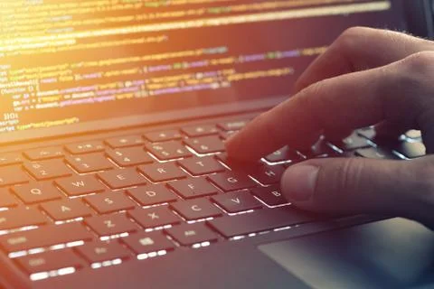 Closeup coding on screen, hands coding html and programming on screen laptop, Stock Photos