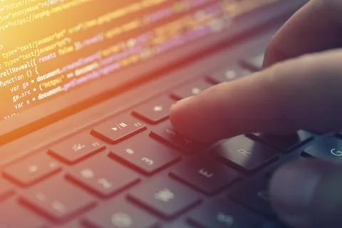 Closeup coding on screen, hands coding html and programming on screen laptop, Stock Photos