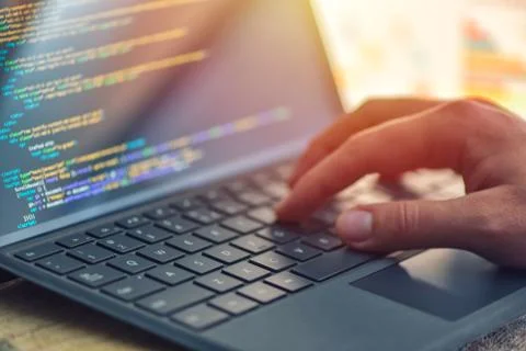 Closeup coding on screen, hands coding html and programming on screen laptop, Stock Photos