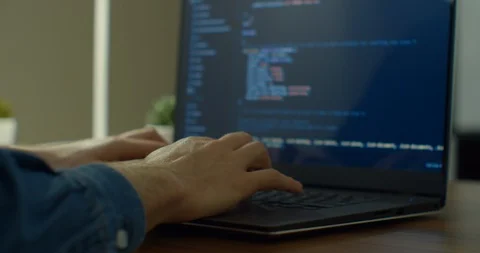 Closeup coding on screen, Man hands coding html and programming on screen laptop Stock Footage 129457284