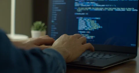 Closeup coding on screen, Man hands coding html and programming on screen laptop Stock Footage 129457372