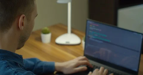 Closeup coding on screen, Man hands coding html and programming on screen laptop Stock Footage 129458134