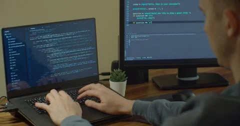 Closeup coding on screen, Man hands coding html and programming on screen Stock Photos