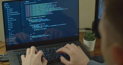 Closeup coding on screen, Man hands coding html and programming on screen Stockfoto's
