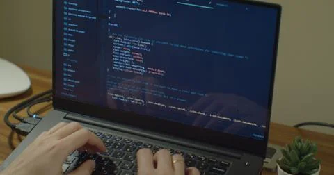Closeup coding on screen, Man hands coding html and programming on screen laptop Stock Photos
