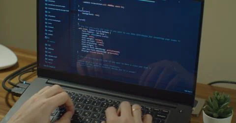 Closeup coding on screen, Man hands coding html and programming on screen laptop Stock Photos