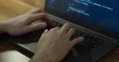 Closeup coding on screen, Man hands coding html and programming on screen laptop Stock Photos