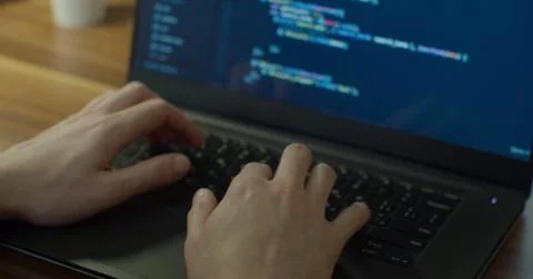 Closeup coding on screen, Man hands coding html and programming on screen laptop Stock Photos