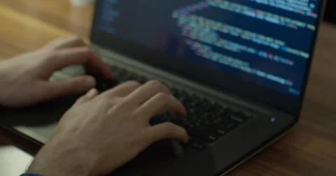 Closeup coding on screen, Man hands coding html and programming on screen laptop Stock Photos