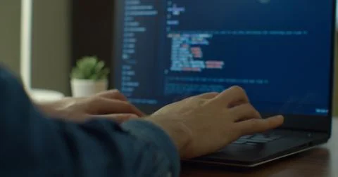 Closeup coding on screen, Man hands coding html and programming on screen laptop 写真素材