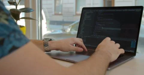 Closeup coding on screen, Man hands coding html and programming on screen laptop Stock Photos