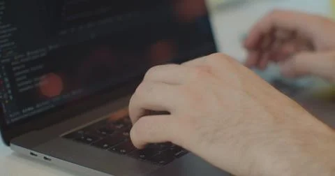 Closeup coding on screen, Man hands coding html and programming on screen laptop 写真素材