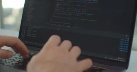 Closeup coding on screen, Man hands coding html and programming on screen laptop Stock Photos