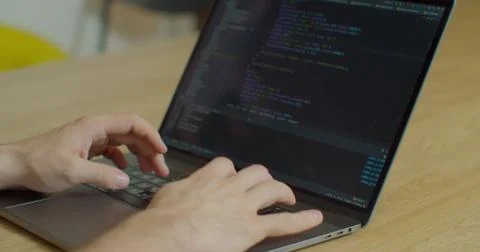 Closeup coding on screen, Man hands coding html and programming on screen laptop Stock Photos