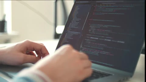 Closeup coding on screen. Man programmer hands coding html programming on screen Stock Footage 254538162