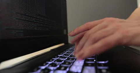 Closeup coding on screen, woman hands coding html and programming on screen Stock-Fotos