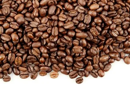 Closeup of coffee beans on plain background Stock Photos