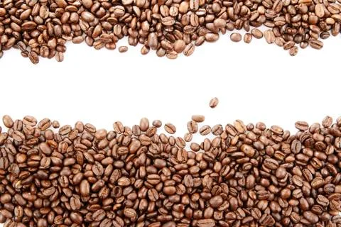 Closeup of coffee beans on plain background Stock Photos