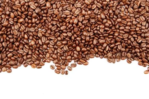 Closeup of coffee beans on plain background Stock Photos