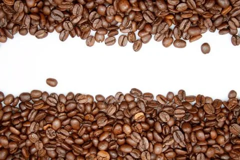 Closeup of coffee beans on plain background Stock Photos