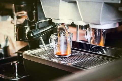 Closeup of coffee machine making espresso process Fotos Stock