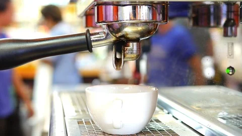 Closeup of coffee maker machine during making shots in coffee shop Video stock 100821969