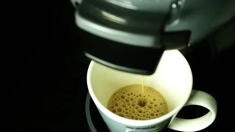 Closeup of coffee with milk preparation from capsule Stock Footage 79630461