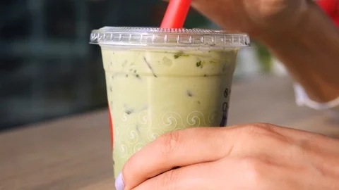 Closeup Up Of Cold Matcha Green Tea Latte In Plastic Cup With Straw Stock Footage 90951994